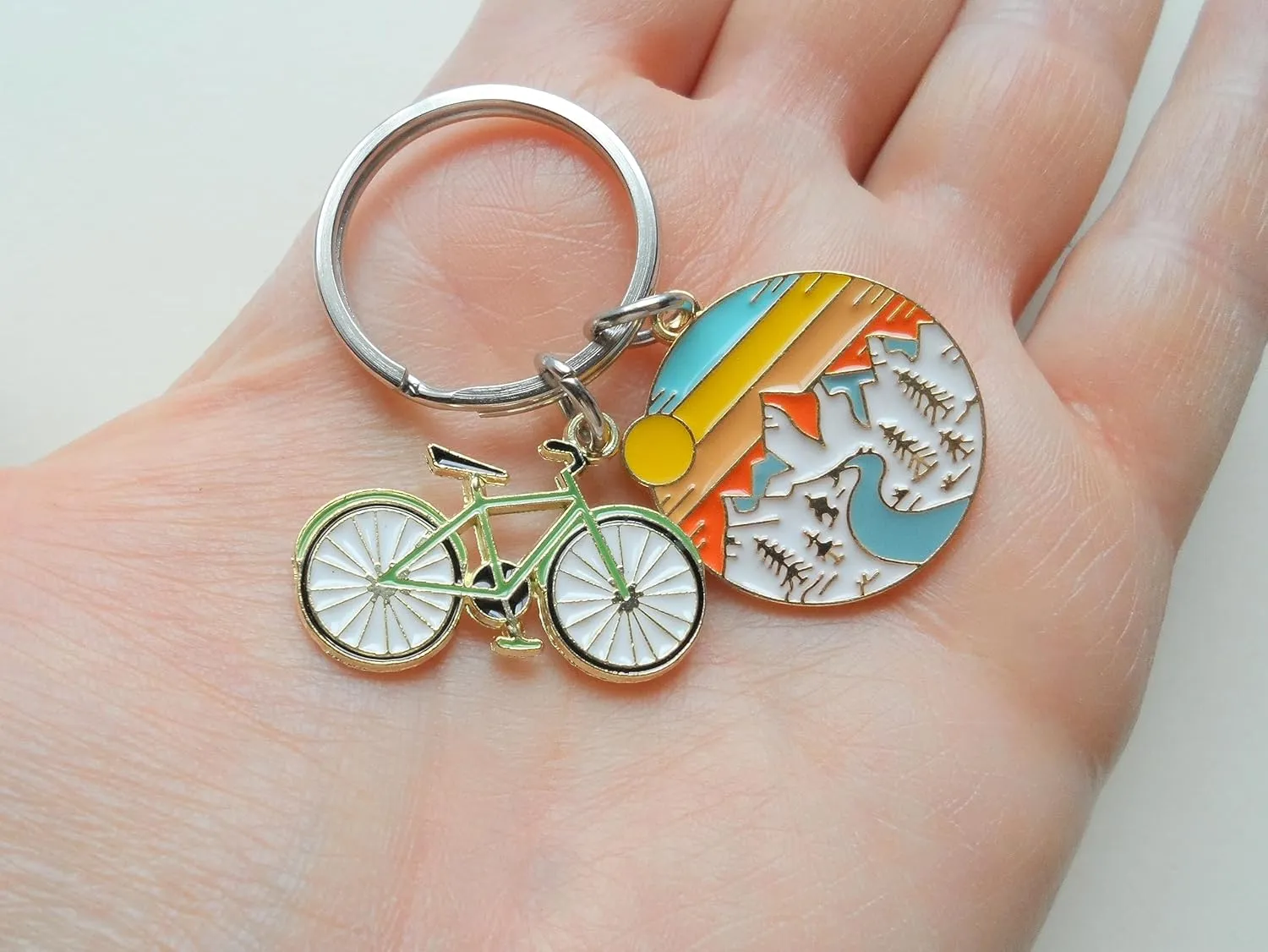 Outdoor Mountain Biking Keychain; Mountain, Trees, River & Orange Sunset Sky Scene Disc Charm Keychain with Bike Charm